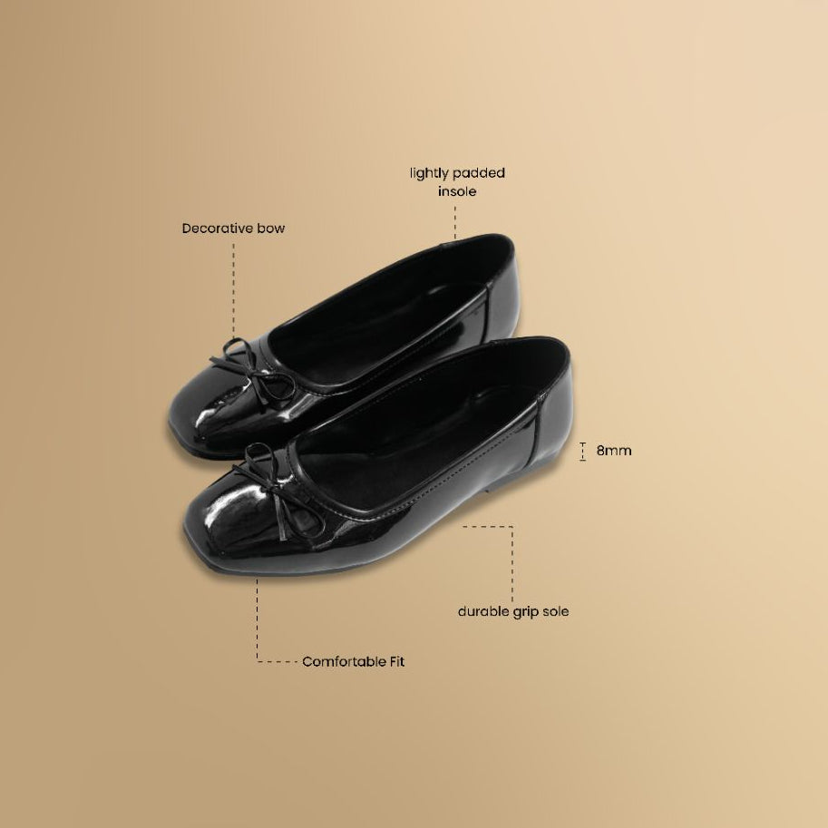 Black shoes with features labeled on a beige background
