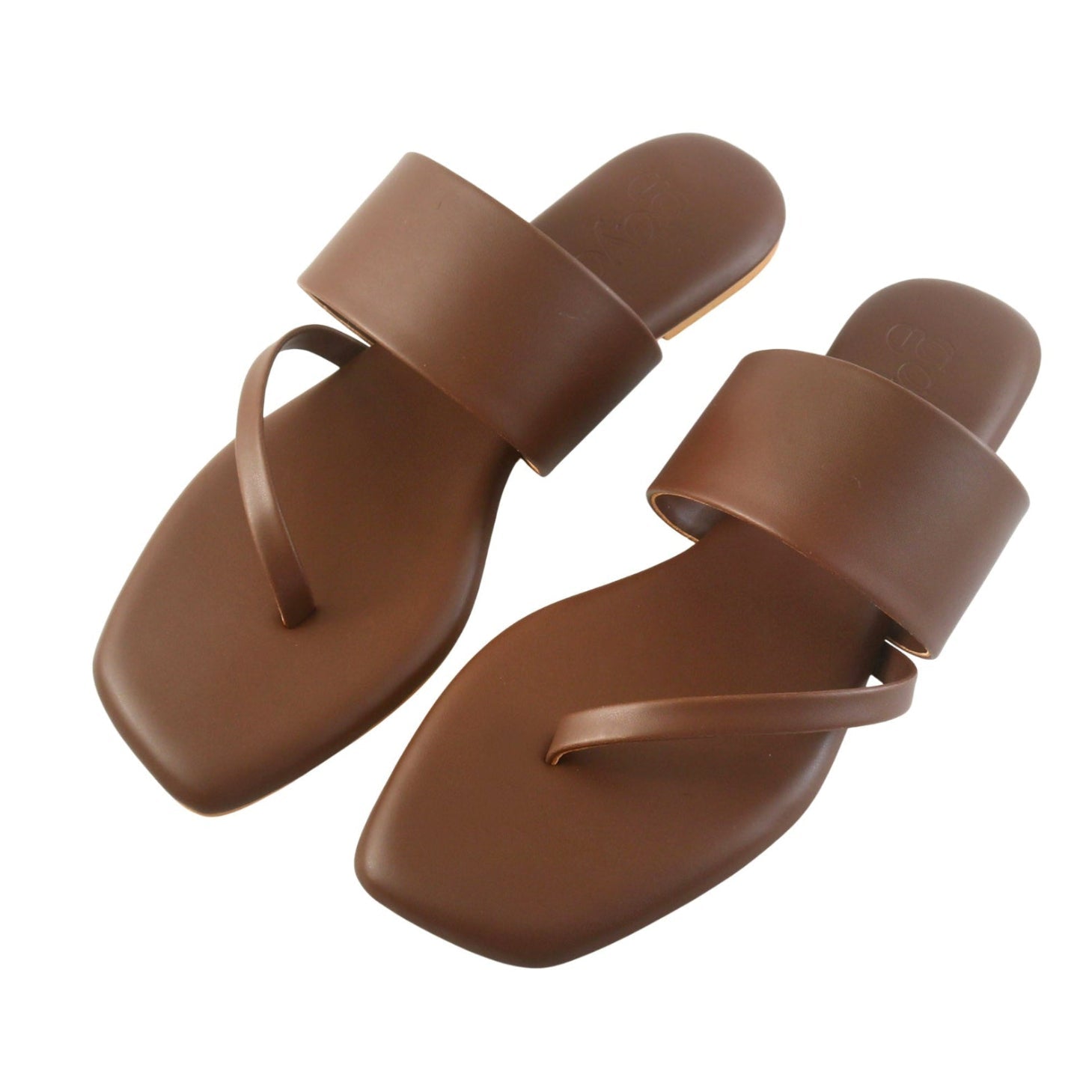 Pair of brown sandals on a white background