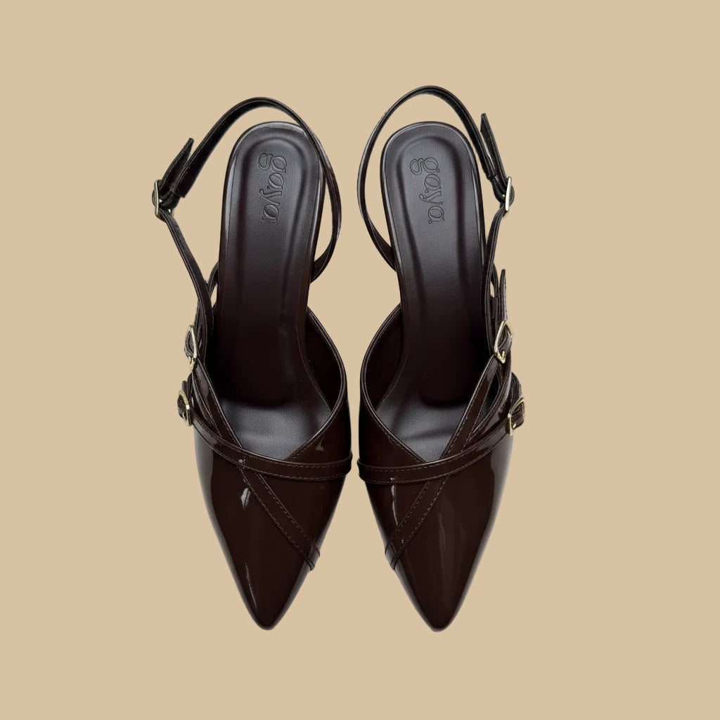 Pair of brown high-heeled shoes with 'Boga' branding on a white background